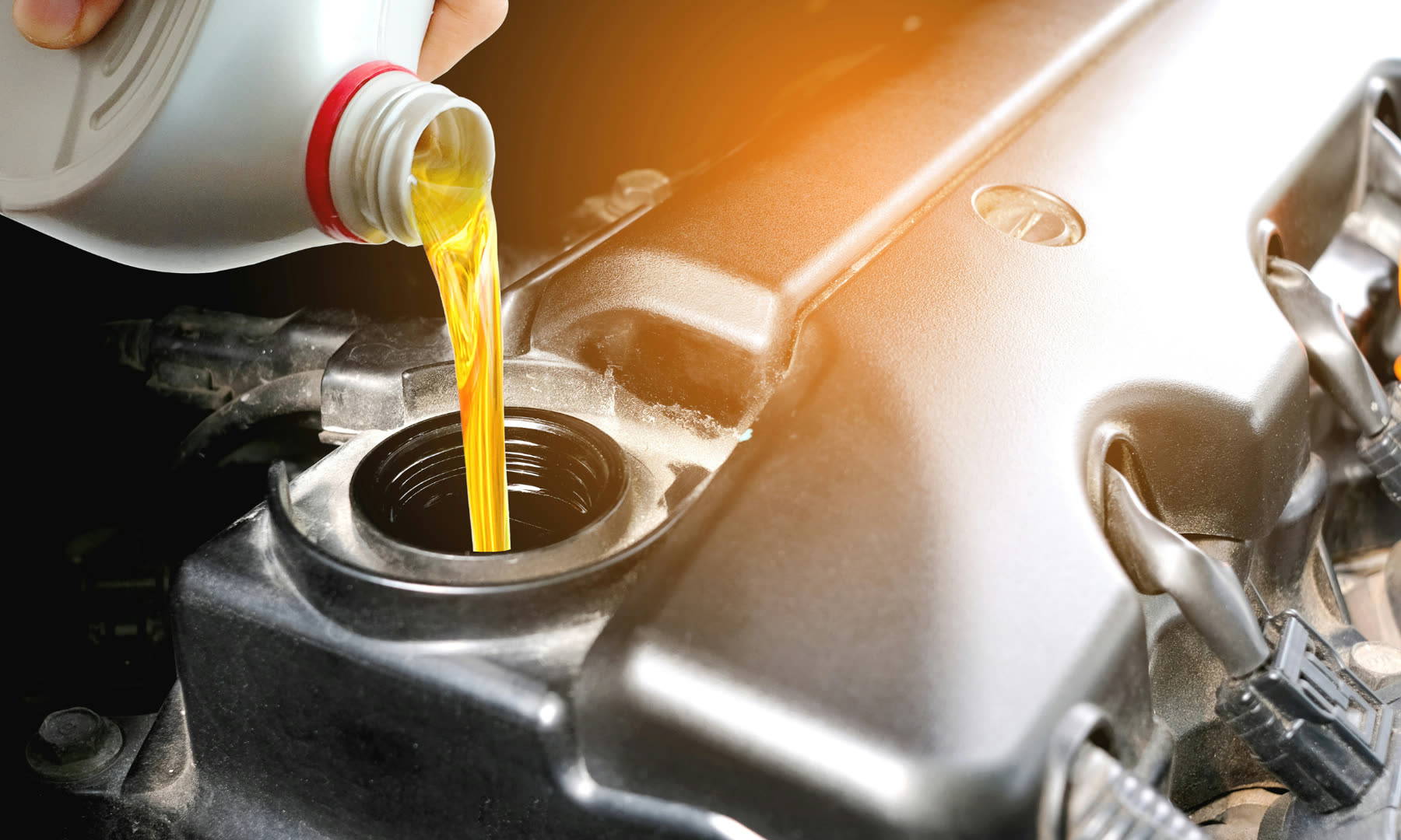 Oil being added to an engine during a routine service